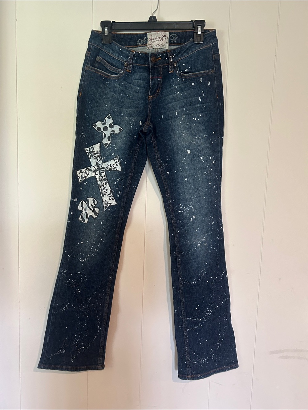 American Rag Dark Indigo Bootcut Jeans with White Cross Accents